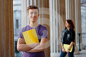 Smiling teenage student outdoors