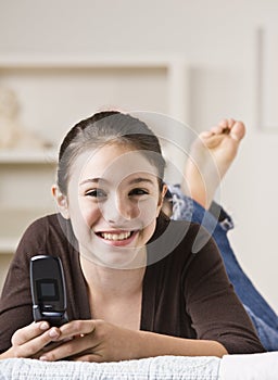 Smiling Teenager With Cellphone