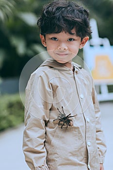 Smiling teenager and his pet a tarantula