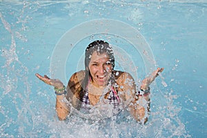 Smiling teenager in pool