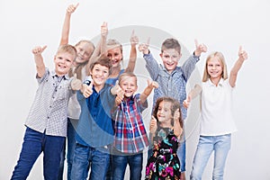The smiling teenagers showing okay sign on white