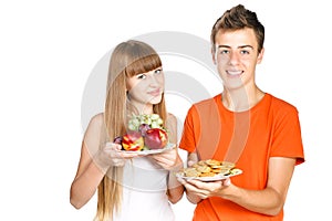 Smiling teenagers shows healthy lunch
