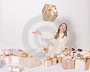 Smiling thirty-year-old woman and box on a white background