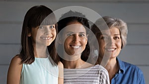 Smiling three generations of Hispanic women together