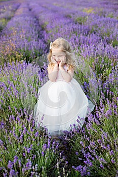 Smiling toddler girl in lavender