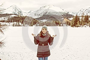 Smiling tourist woman in Strbske pleso resort, Slovakia