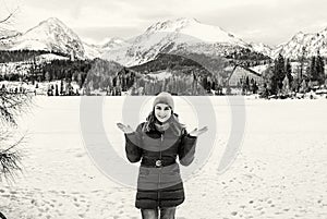 Smiling tourist woman in Strbske pleso resort, Slovakia, colorless