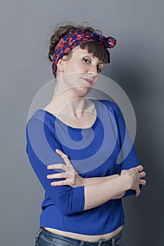 Smiling trendy woman with chin up and pretentious body language photo