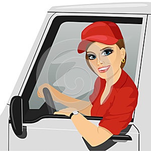 Smiling truck female driver in the car