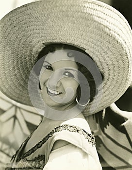 Smiling under her straw hat