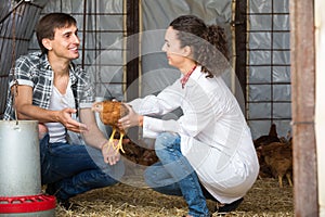 Smiling veterinarian talking to farmer