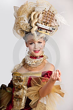 Smiling woman in 18th century style red dress photo