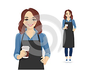 Smiling woman in apron holding coffee