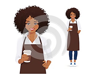 Smiling woman in apron holding coffee