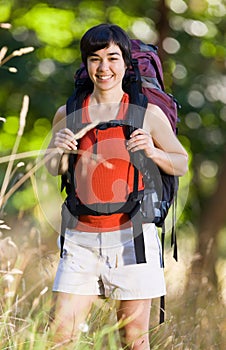 Smiling woman with backpack