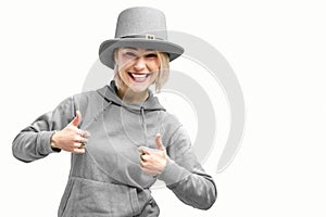 Smiling woman. Beautifu youngl woman wearing gray hat and in a gray sweatshirt
