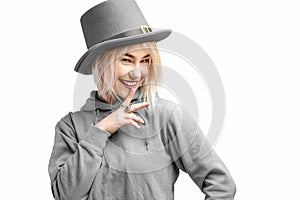 Smiling woman. Beautifu youngl woman wearing gray hat and in a gray sweatshirt