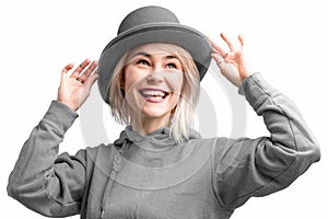 Smiling woman. Beautifu youngl woman wearing gray hat and in a gray sweatshirt