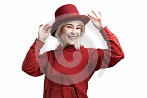 Smiling woman. Beautifu youngl woman wearing red hat and in a red sweatshirt