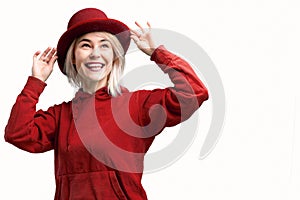 Smiling woman. Beautifu youngl woman wearing red hat and in a red sweatshirt