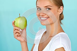 Smiling Woman With Beautiful Smile, White Teeth Holding Apple