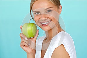 Smiling Woman With Beautiful Smile, White Teeth Holding Apple