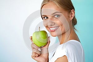 Smiling Woman With Beautiful Smile, White Teeth Holding Apple