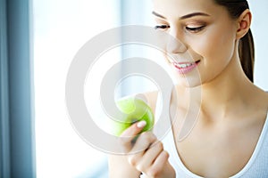 Smiling Woman With Beautiful Smile, White Teeth Holding Apple. H