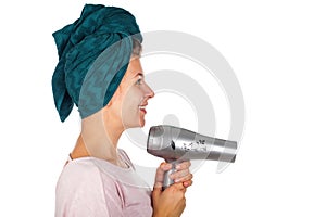 Smiling woman blow drying her hair