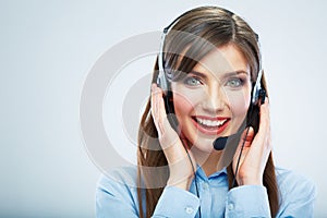 Smiling woman call center operator touching headsed. Close up b