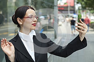 Smiling Woman Capturing A Self Shot photo