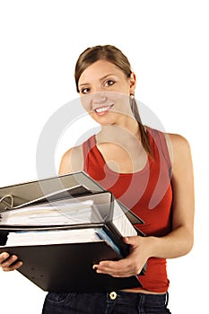 Smiling woman carrying binders