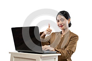 Smiling woman in civil servant uniform using laptop thumb up