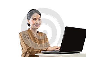 Smiling woman in civil servant uniform using laptop to work