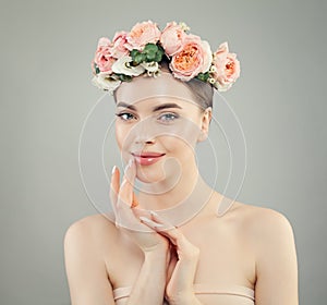 Smiling woman with clear skin. Spa model with flowers