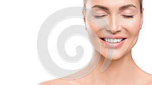 Smiling woman with closed eyes over white background. Dental and skin care concept