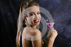 Smiling woman with cocktail