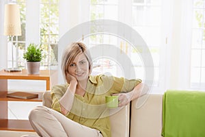 Smiling woman with coffee