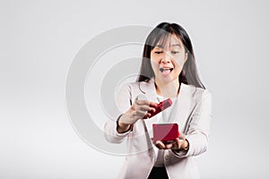 Smiling woman confidence opening a red gift box on palm isolated white background