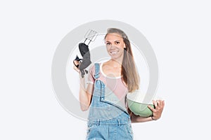 Smiling woman cooking on empty white background