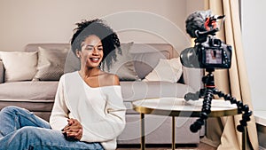 Smiling woman creating video content photo