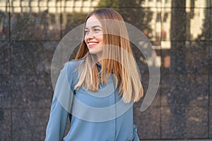 Smiling woman with crossed arms portrait