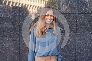 Smiling woman with crossed arms portrait