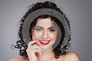 Smiling woman with curls hairstyle