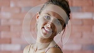 Smiling woman with cute hairdo