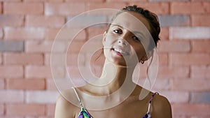 Smiling woman with cute hairdo