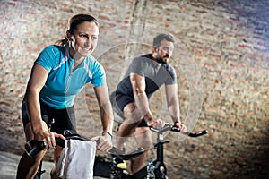 Smiling woman on cycling fitness training