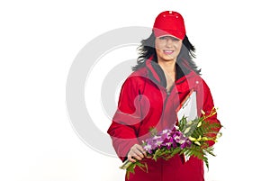 Smiling woman delivering flowers