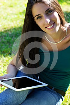 Smiling woman with digital tablet