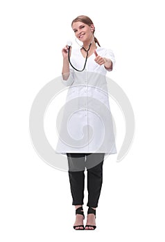 Smiling woman doctor showing her stethoscope. isolated on white